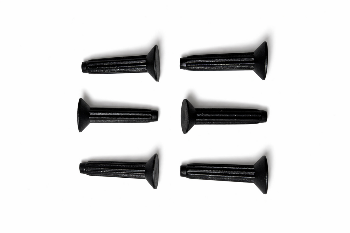 Set of six black screws on a white background